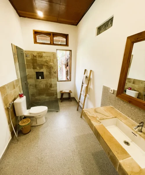 A spacious bathroom with window