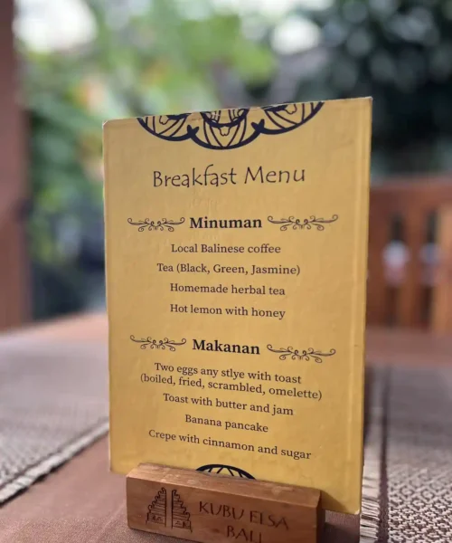Breakfast menu displayed on a dining table at Kubu Elsa Bali