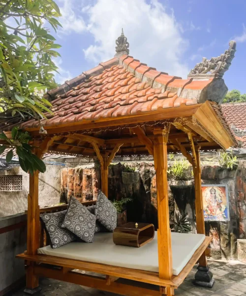 Cushioned daybed inside the traditional poolside gazebo