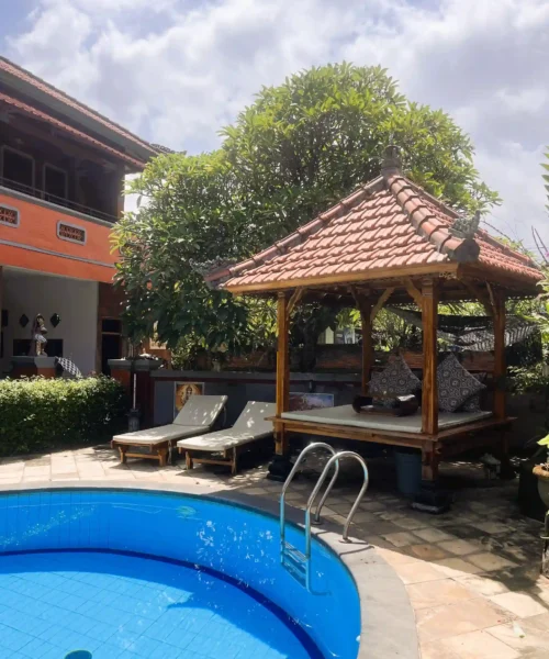 Swimming pool, tropical garden and traditional gazebo at Kubu Elsa Bali