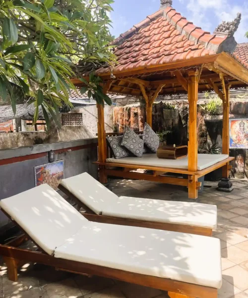 Traditional pool gazebo and sunbeds at Kubu Elsa Bali
