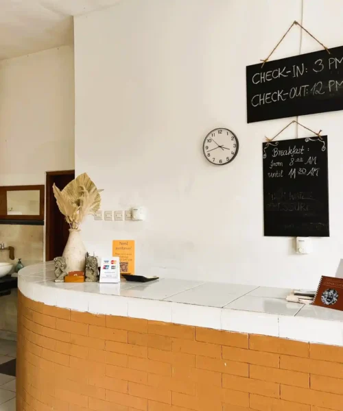 Reception desk with check-in, breakfast and guest information